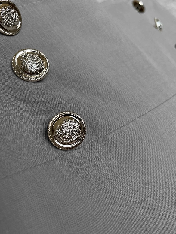 Eleganckie szare spodnie damskie ze złotymi guzikami